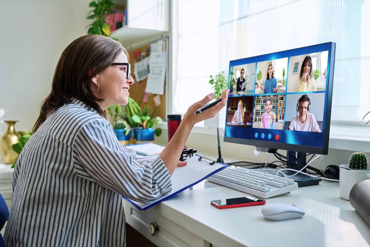 Professional joining a video call on a desktop computer